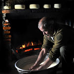 a shepherd making cheese