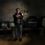 a proud vernaccia wine producer in his own cellar