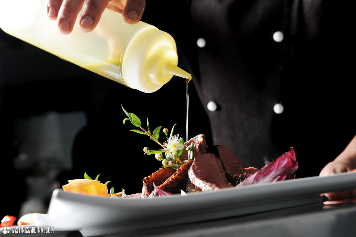 Gourmet Chef pouring olive oil