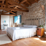 the massive rock wall of the accomodation bedroom