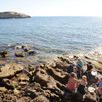 our local insider Ivo teaching how to clean fish 'on the rocks' in Sarchittu for Sardinian fish soup cooking lesson