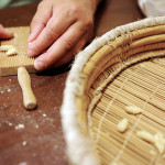 giving the right shape to malloreddus during home-made pasta cooking lesson