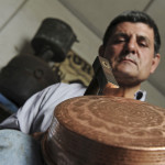 coppersmith Luigi Pitzalis working in his own workshop